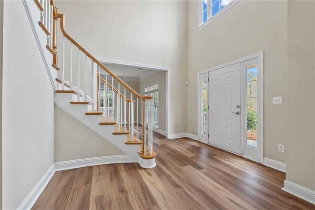 4115 Montvale Crossing Cumming, GA 30041 - Photo 2 of 40 a view of entryway with wooden floor