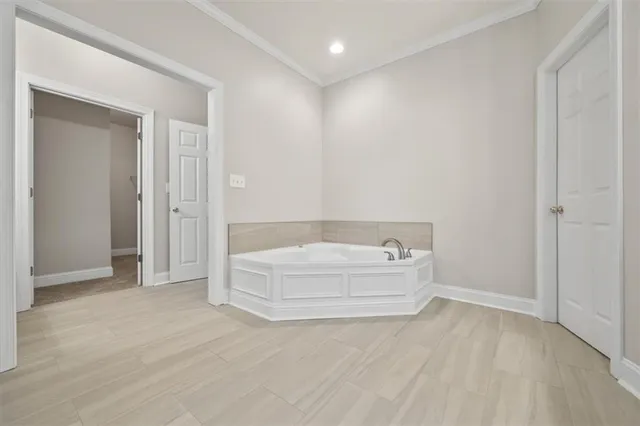 a bathroom with a bathtub and shower