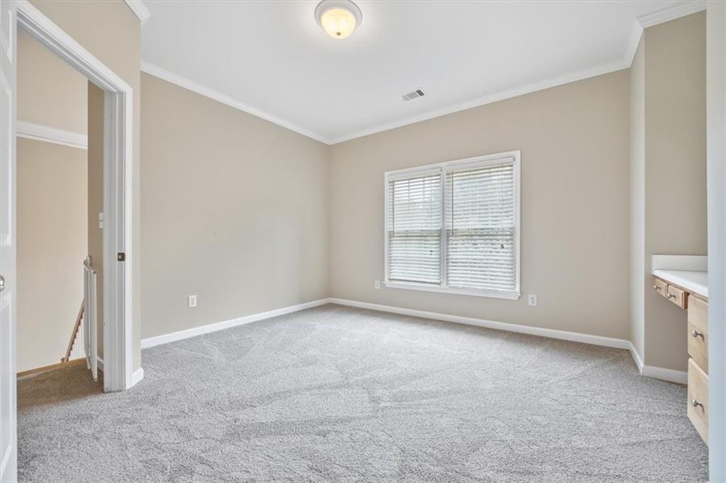 4115 Montvale Crossing Cumming, GA 30041 - Photo 26 of 40 an empty room with windows and closet