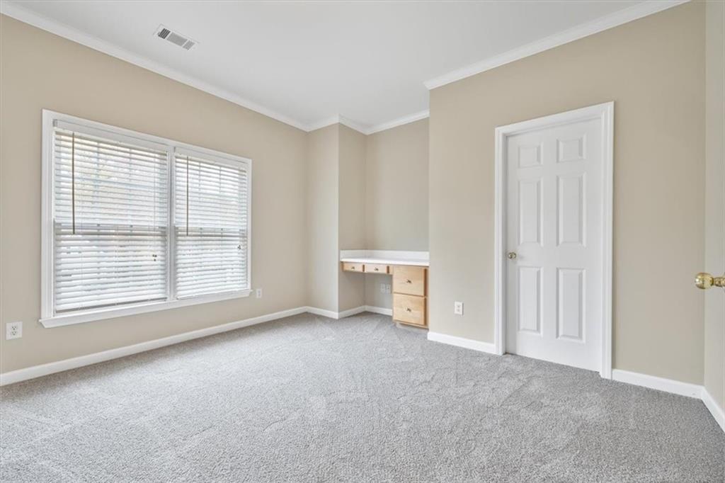 4115 Montvale Crossing Cumming, GA 30041 - Photo 27 of 40 a view of an empty room with a window