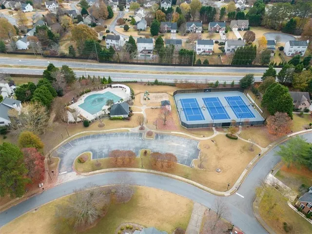 an aerial view of a swimming pool with outdoor space