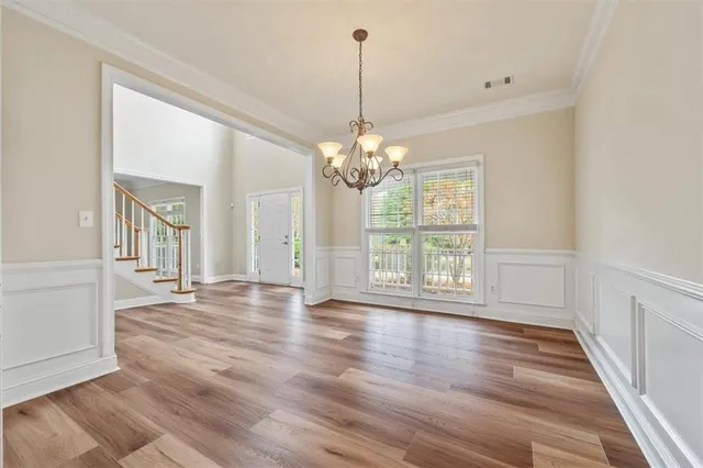 a view of a room with window and wooden floor