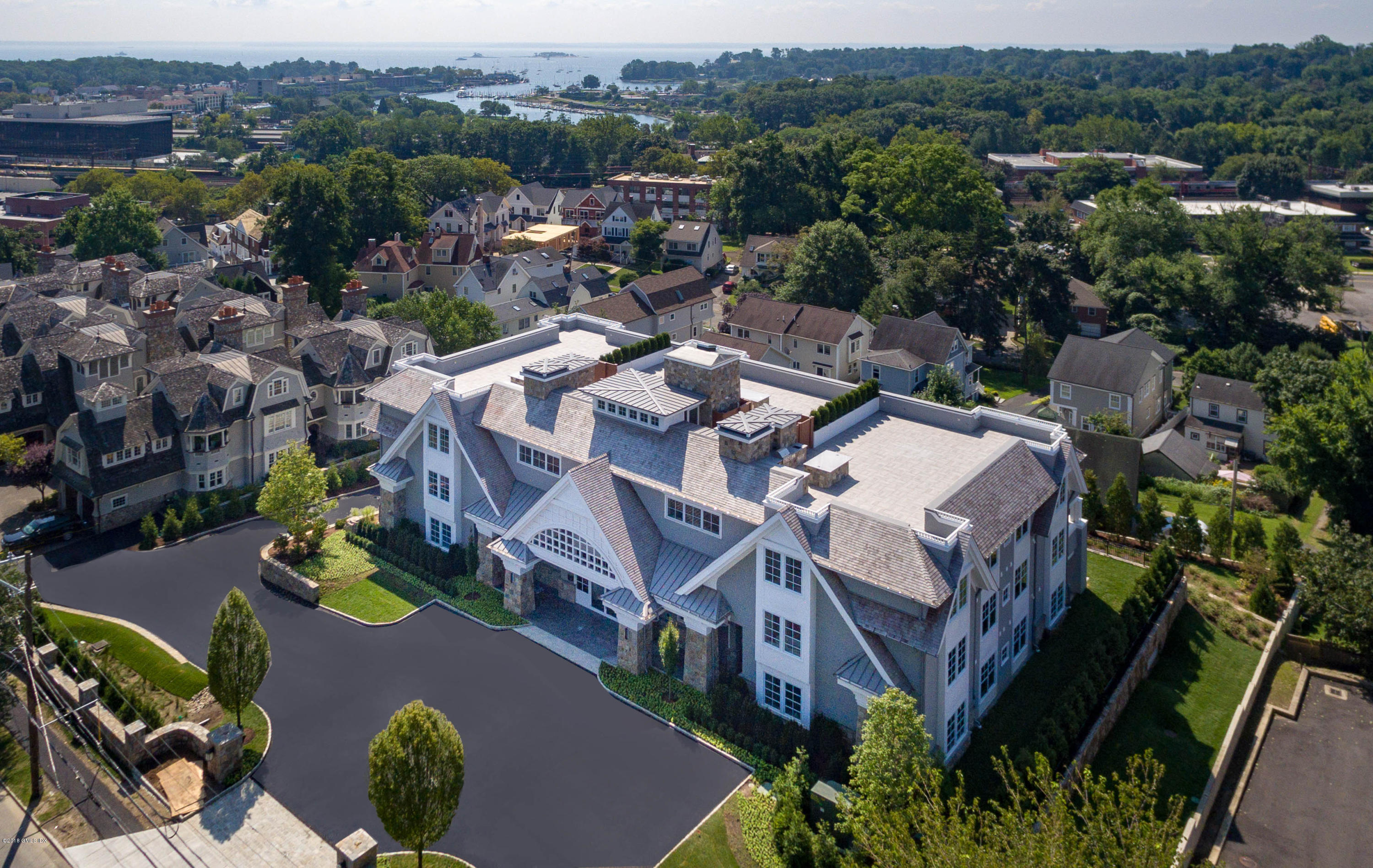 70 Sound View Drive, Unit 2 WEST Greenwich, CT 06830 - Photo 1 of 12 an aerial view of a house with a yard and lake view
