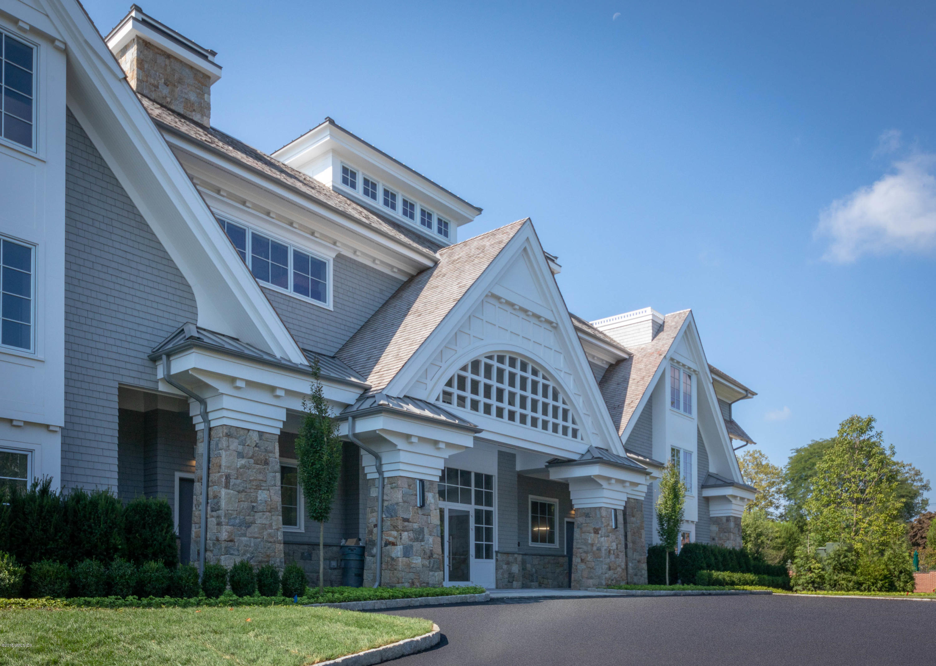 70 Sound View Drive, Unit 2 WEST Greenwich, CT 06830 - Photo 12 of 12 front view of a building with a garden