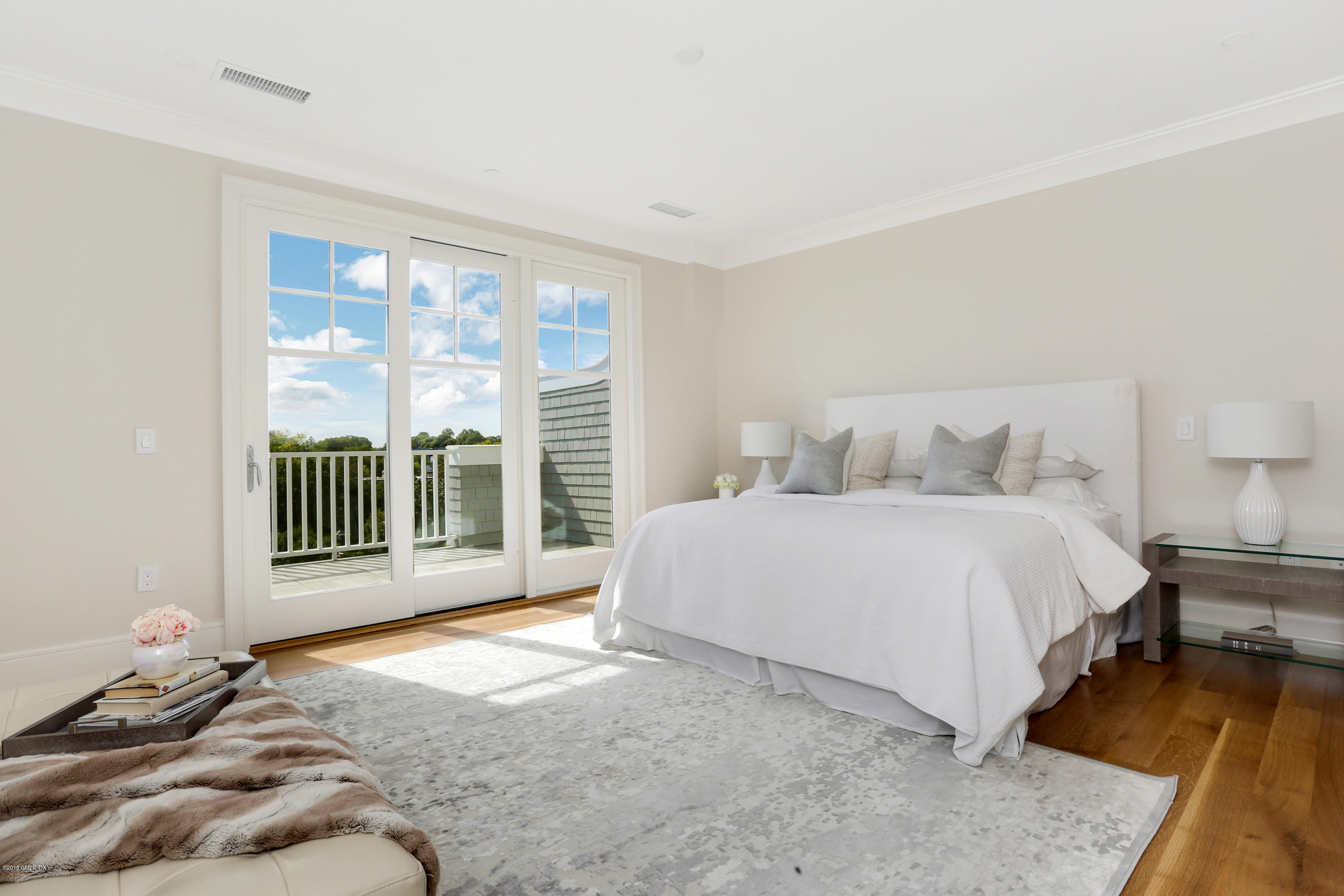 70 Sound View Drive, Unit 2 WEST Greenwich, CT 06830 - Photo 6 of 12 a bedroom with a bed and a window