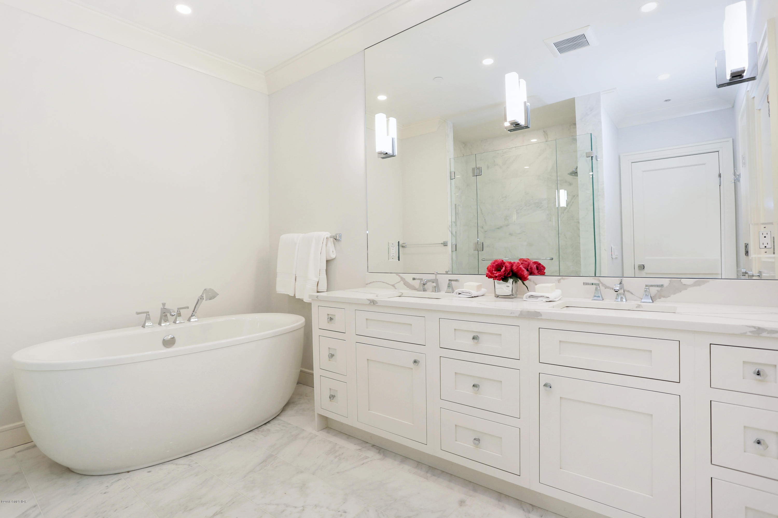 70 Sound View Drive, Unit 2 WEST Greenwich, CT 06830 - Photo 7 of 12 a bathroom with a double vanity sink mirror and double