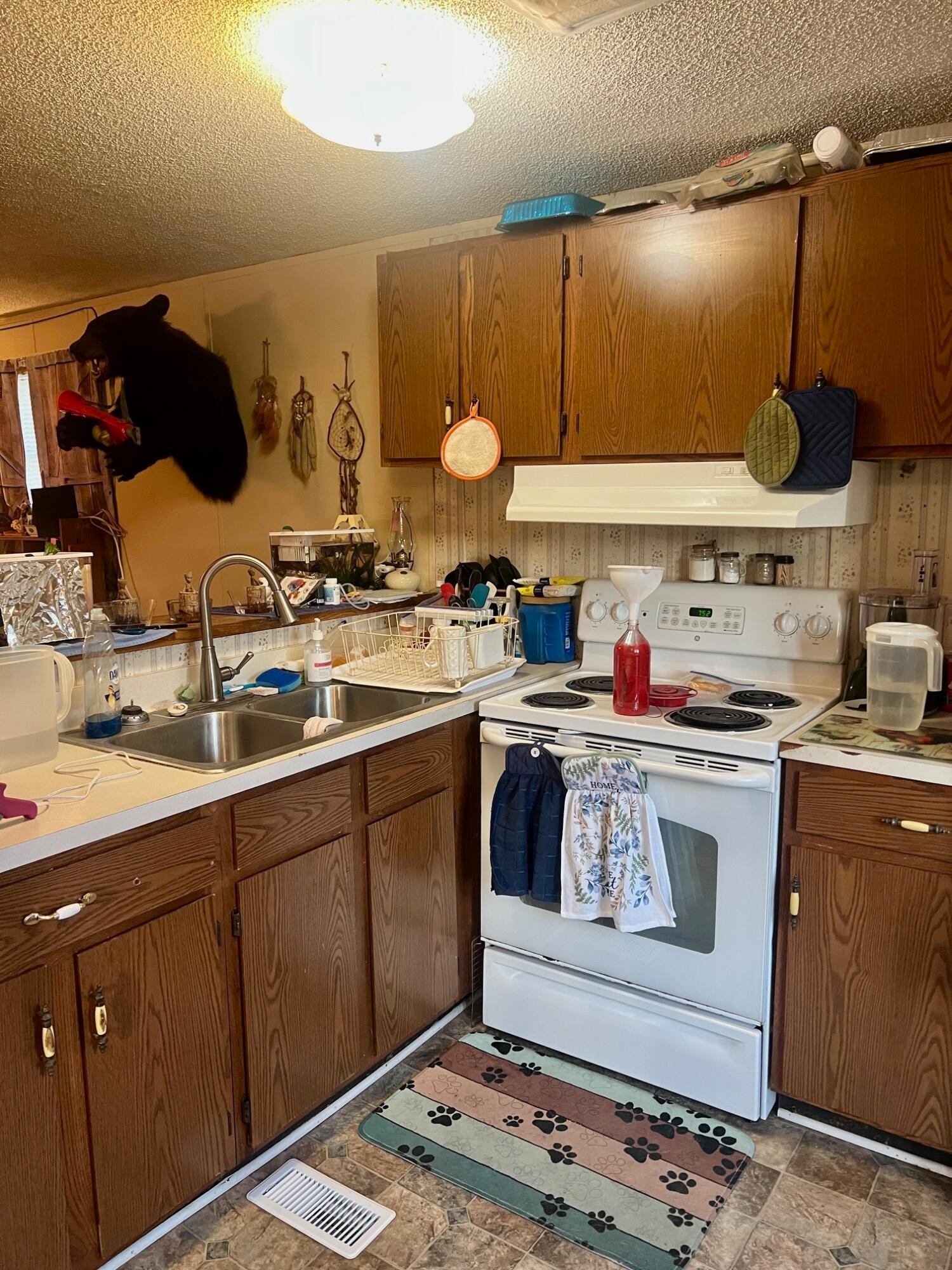 110 Gibson Road Madisonville, TN 37354 - Photo 22 of 32 a kitchen with a stove and cabinets