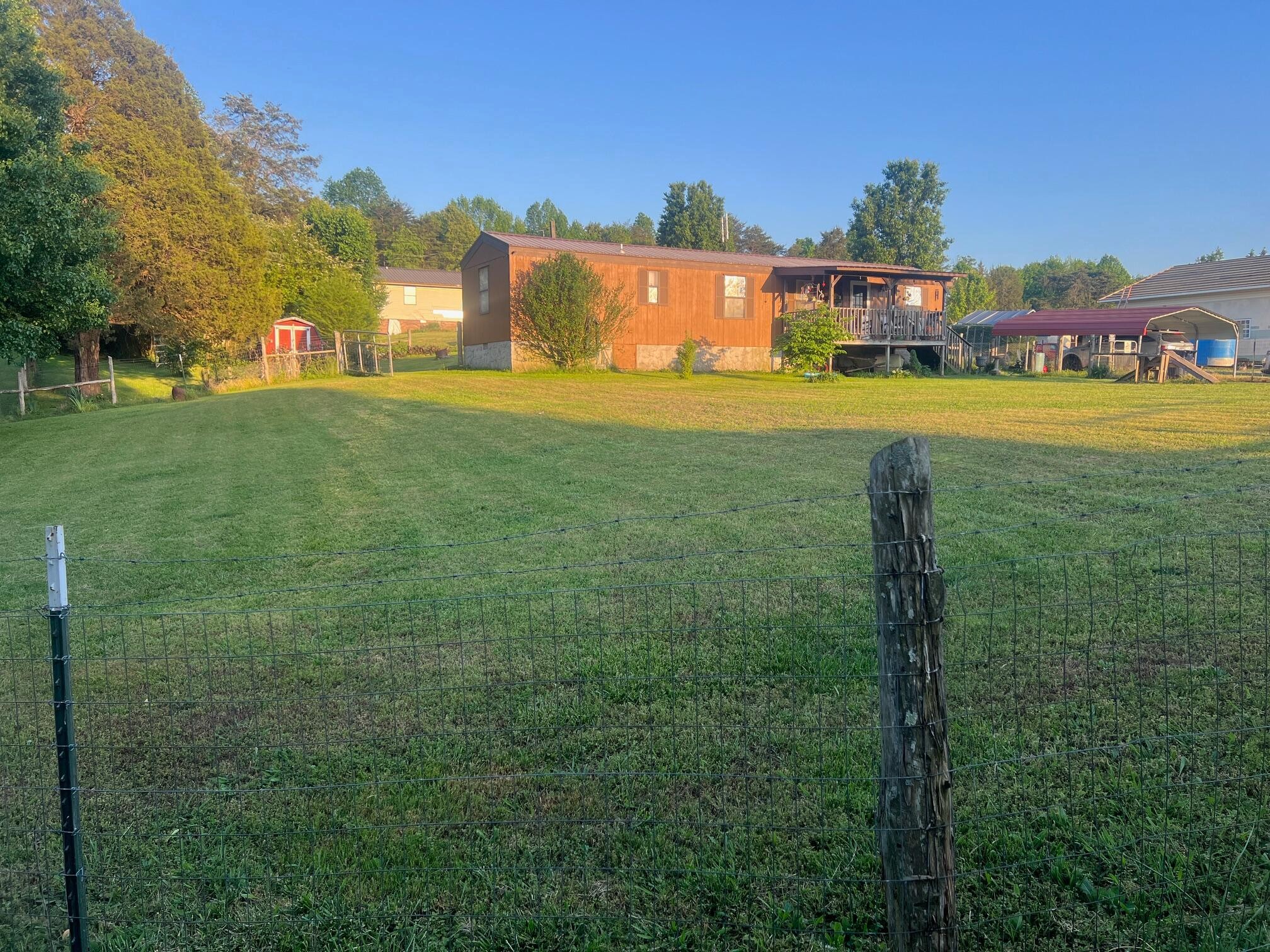 110 Gibson Road Madisonville, TN 37354 - Photo 3 of 32 a building with trees in the background
