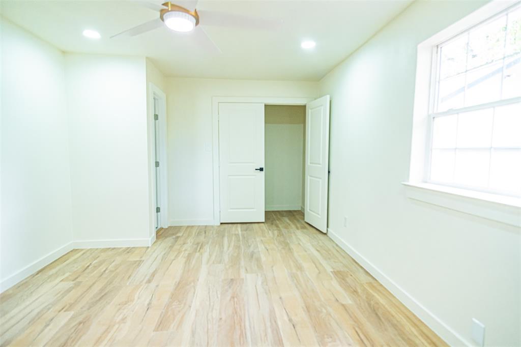 1832 Johnson Road Keller, TX 76248 - Photo 15 of 25 Light wood-finish flooring, recessed ceiling lighting, a modern ceiling fan, and white paneled doors with dark hardware