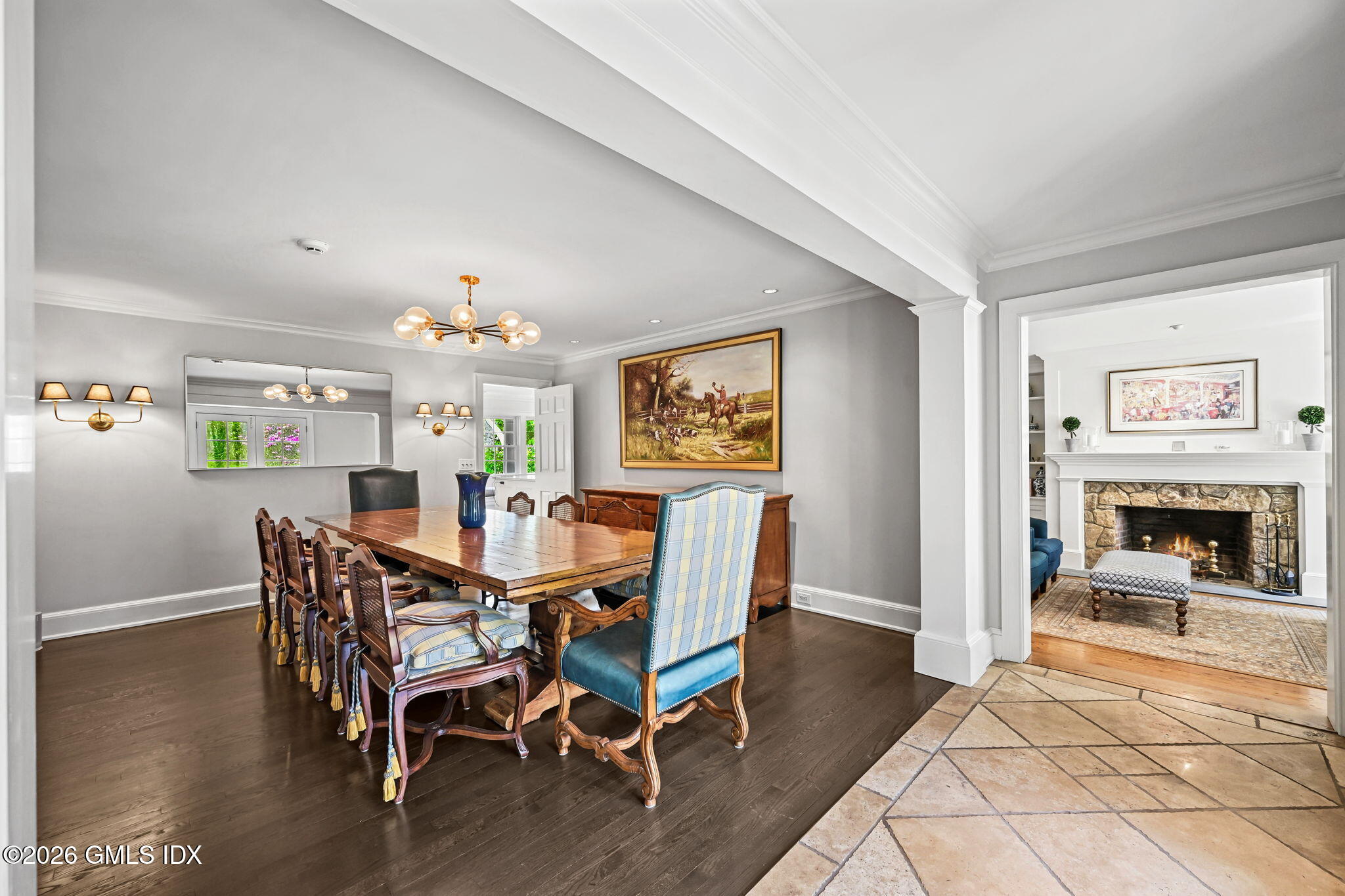 8 Haskell Lane Darien, CT 06820 - Photo 17 of 40 a view of a dining room with furniture wooden floor and a fireplace