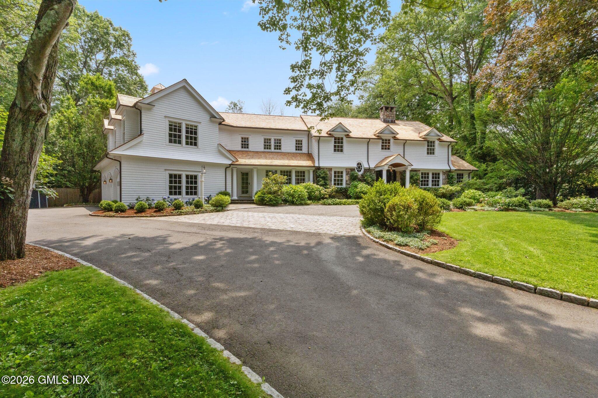 8 Haskell Lane Darien, CT 06820 - Photo 2 of 40 a front view of a house with a yard