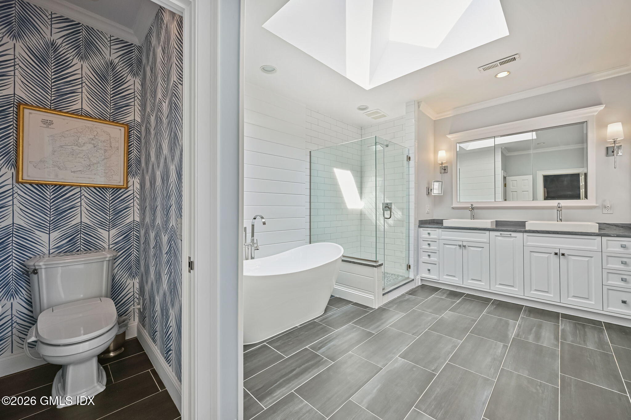 8 Haskell Lane Darien, CT 06820 - Photo 25 of 40 a bathroom with a sink a toilet and shower