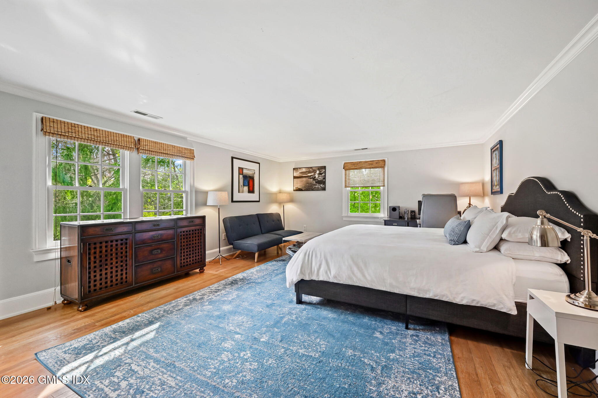 8 Haskell Lane Darien, CT 06820 - Photo 27 of 40 a bedroom with a bed and wooden floor