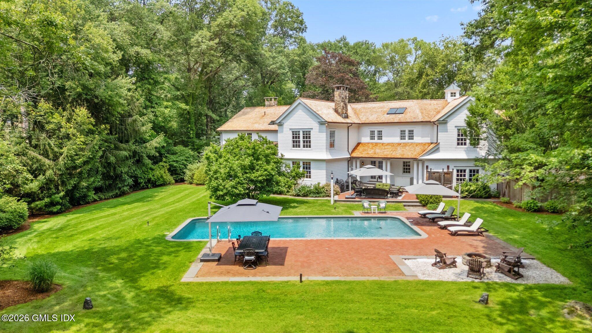 8 Haskell Lane Darien, CT 06820 - Photo 38 of 40 a aerial view of a house with swimming pool garden and patio