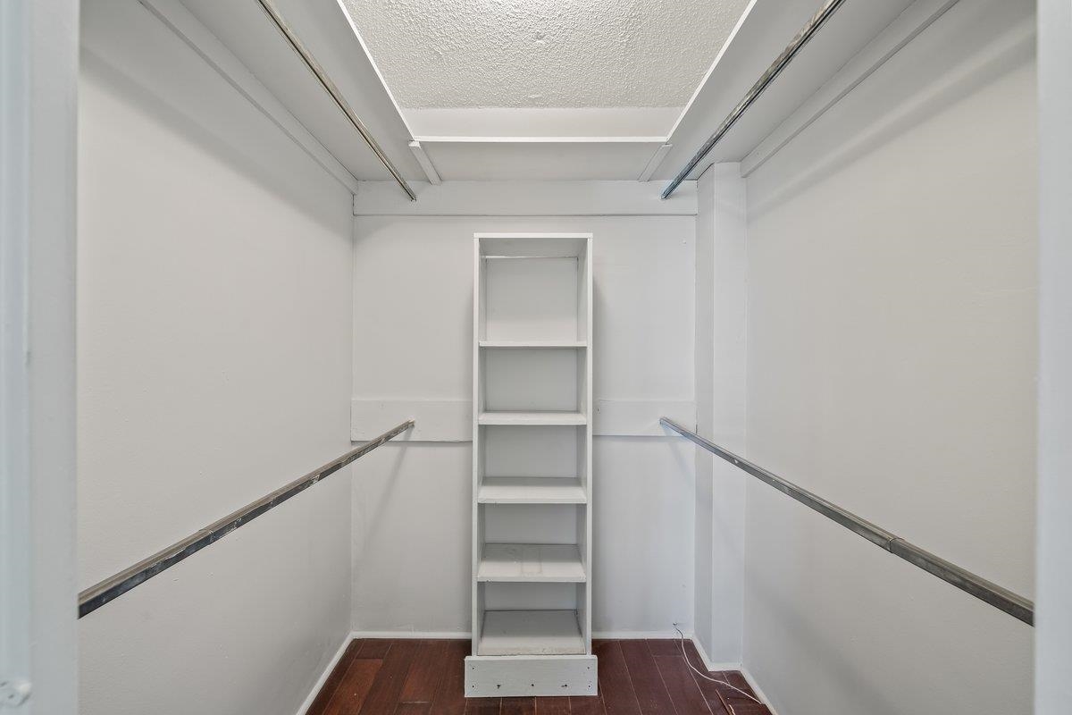 3080 Walnut Grove Road, Unit 507 Memphis, TN 38111 - Photo 20 of 27 Spacious closet featuring dark wood finished floors
