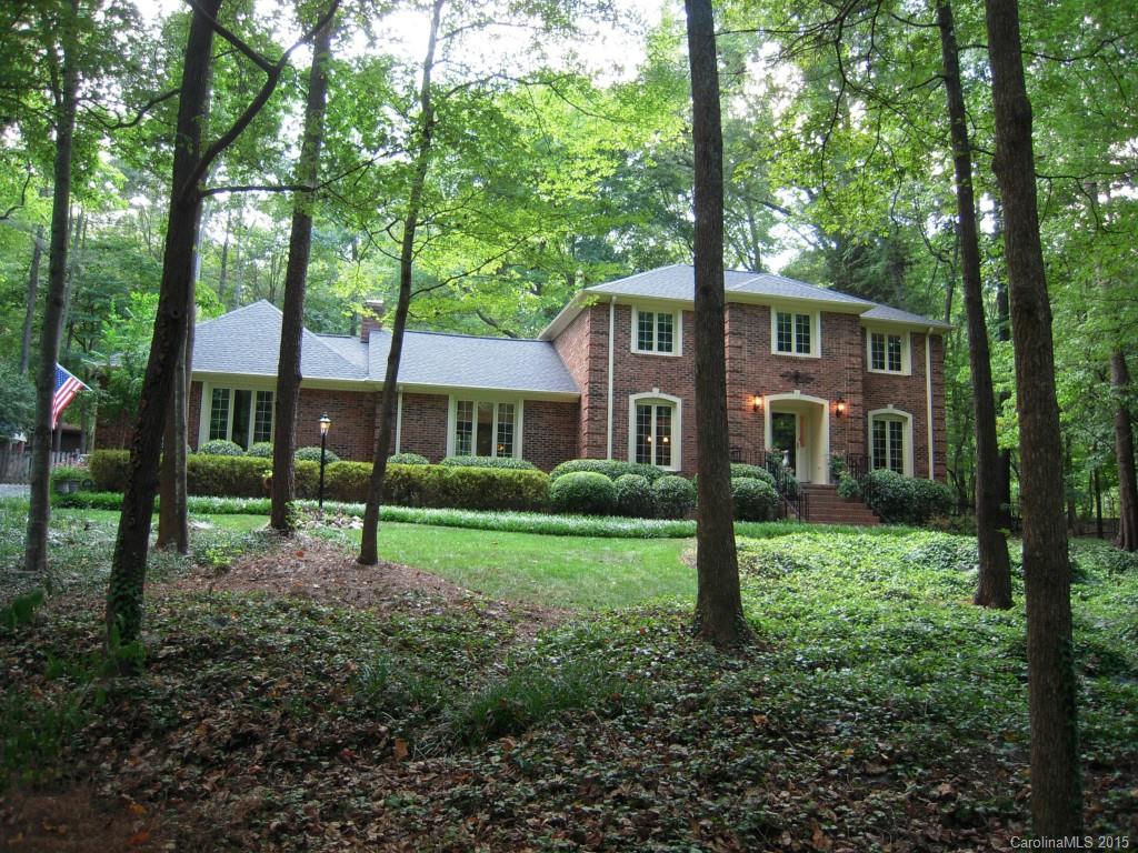 3226 Gray Moss Road Charlotte, NC 28270 - Photo 2 of 24 a view of a brick house with a yard and large trees