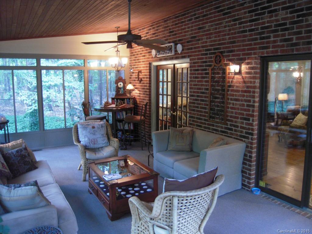 3226 Gray Moss Road Charlotte, NC 28270 - Photo 14 of 24 a living room with furniture and a floor to ceiling window
