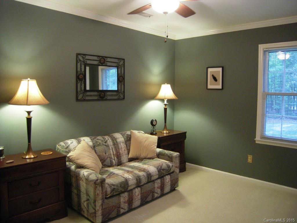 3226 Gray Moss Road Charlotte, NC 28270 - Photo 16 of 24 a living room with a lamp and a lamp