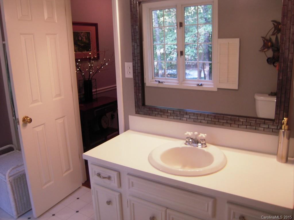 3226 Gray Moss Road Charlotte, NC 28270 - Photo 17 of 24 a bathroom with a sink and a mirror