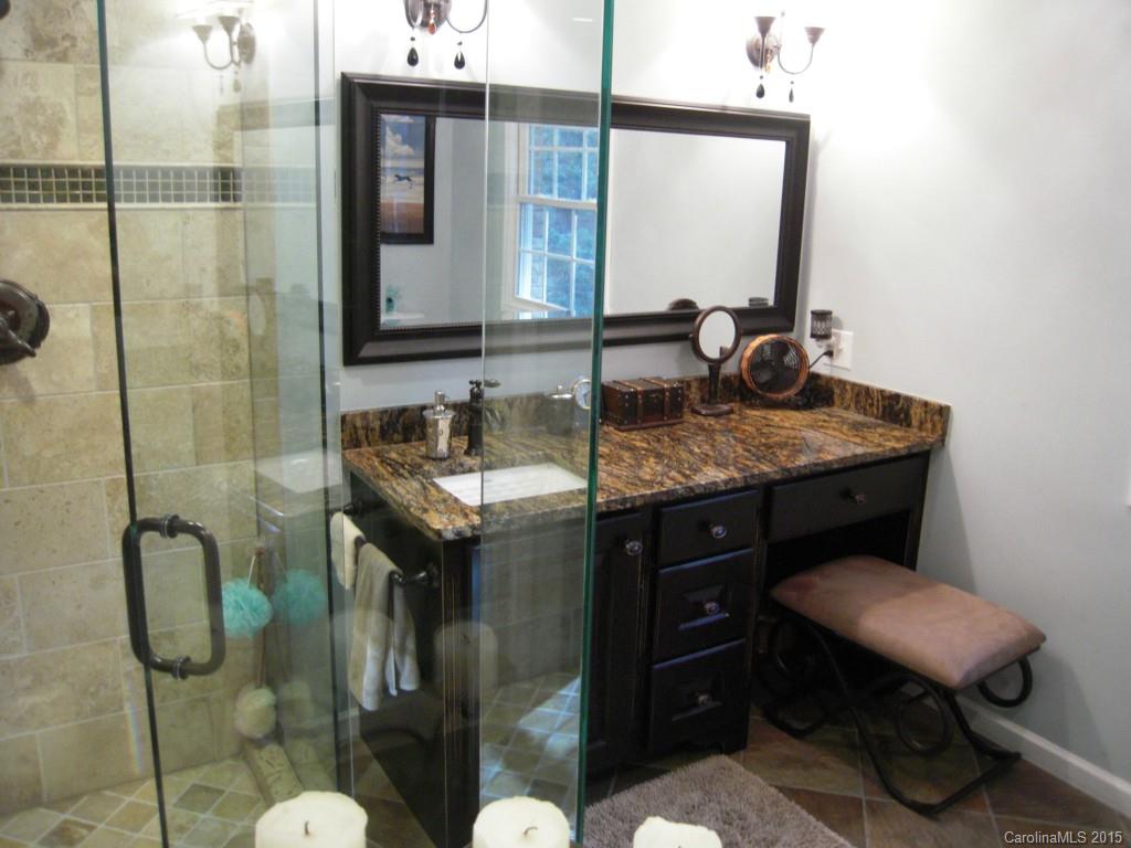 3226 Gray Moss Road Charlotte, NC 28270 - Photo 19 of 24 a bathroom with a sink toilet and mirror