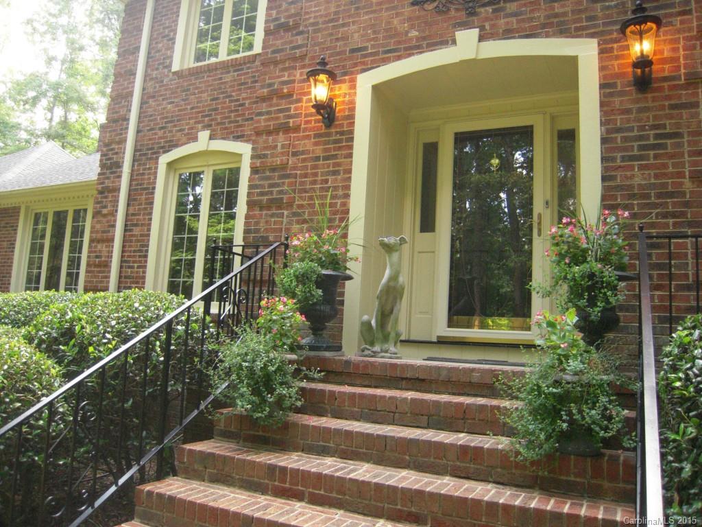 3226 Gray Moss Road Charlotte, NC 28270 - Photo 4 of 24 a view of a house with a large windows and flower plants