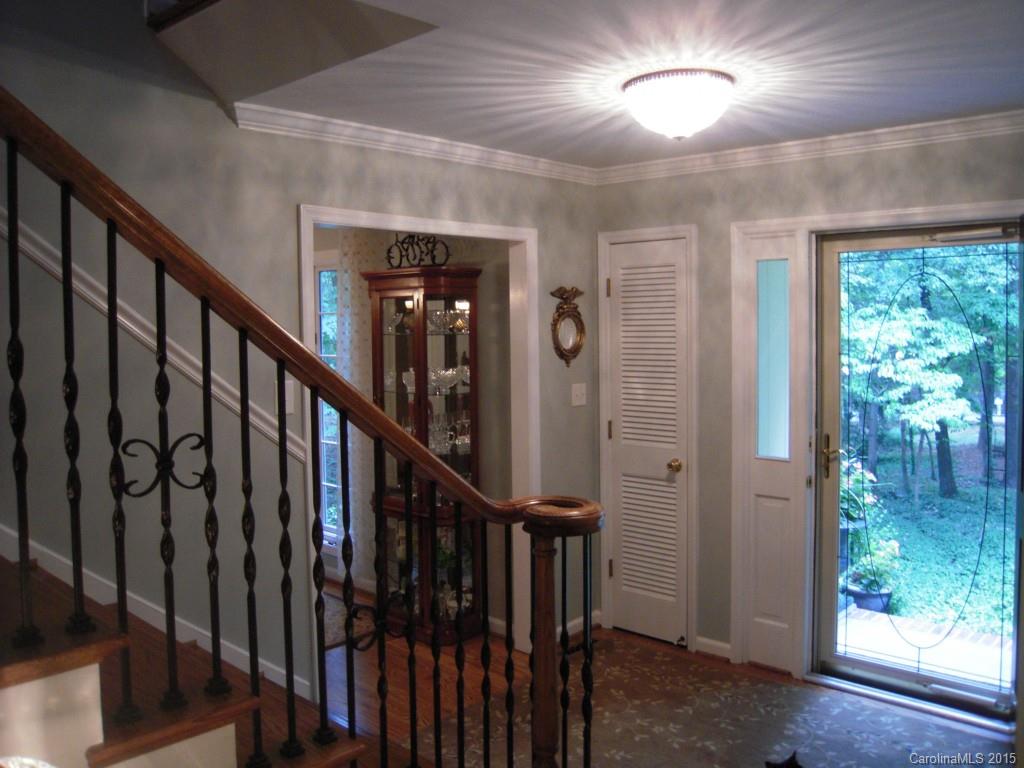 3226 Gray Moss Road Charlotte, NC 28270 - Photo 5 of 24 a view of staircase with wooden floor and stairs