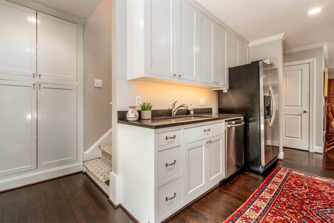1321 Brooks Avenue Raleigh, NC 27607 - Photo 8 of 30 The timeless Shaker cabinets feature interior plugs so small appliances stay hidden and allow for LOTS of storage. Kitchen
