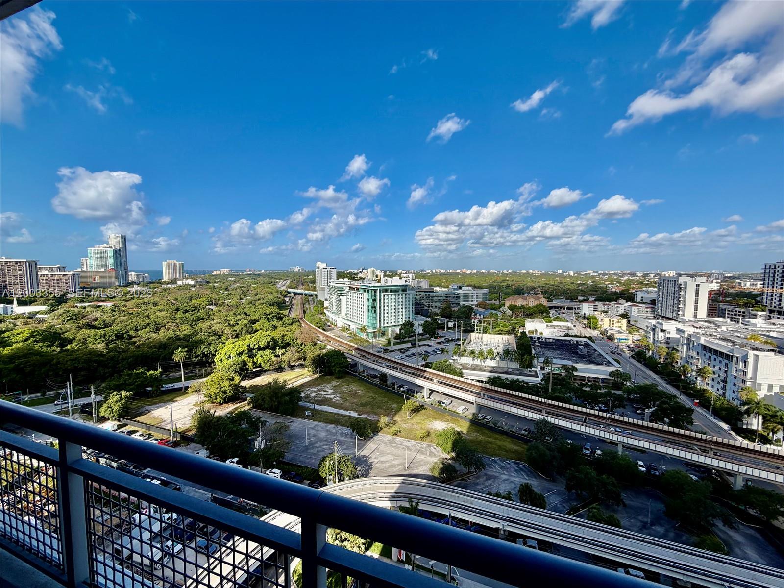 60 Southwest 13th Street, Unit 1605 Miami, FL 33130 - Photo 12 of 18 a view of a balcony with chairs