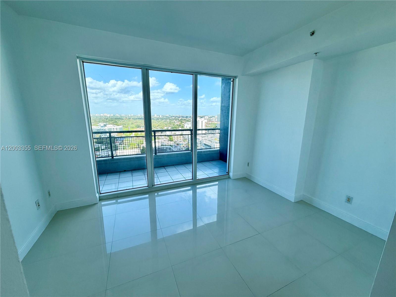 60 Southwest 13th Street, Unit 1605 Miami, FL 33130 - Photo 16 of 18 a view of an empty room with a window