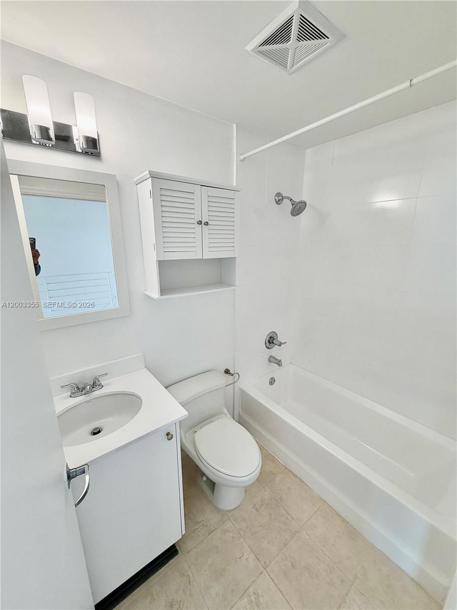 60 Southwest 13th Street, Unit 1605 Miami, FL 33130 - Photo 18 of 18 a bathroom with a sink a toilet and a bathtub