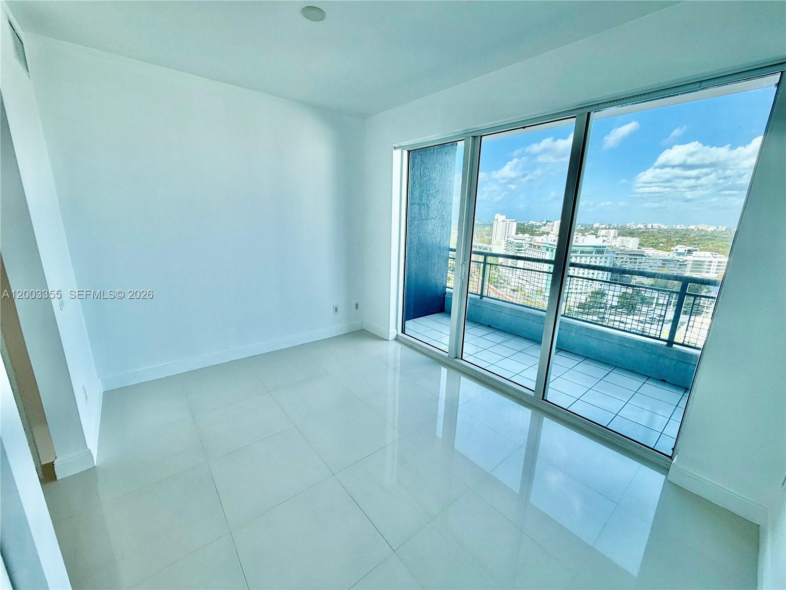 60 Southwest 13th Street, Unit 1605 Miami, FL 33130 - Photo 3 of 18 a view of an empty room with a window
