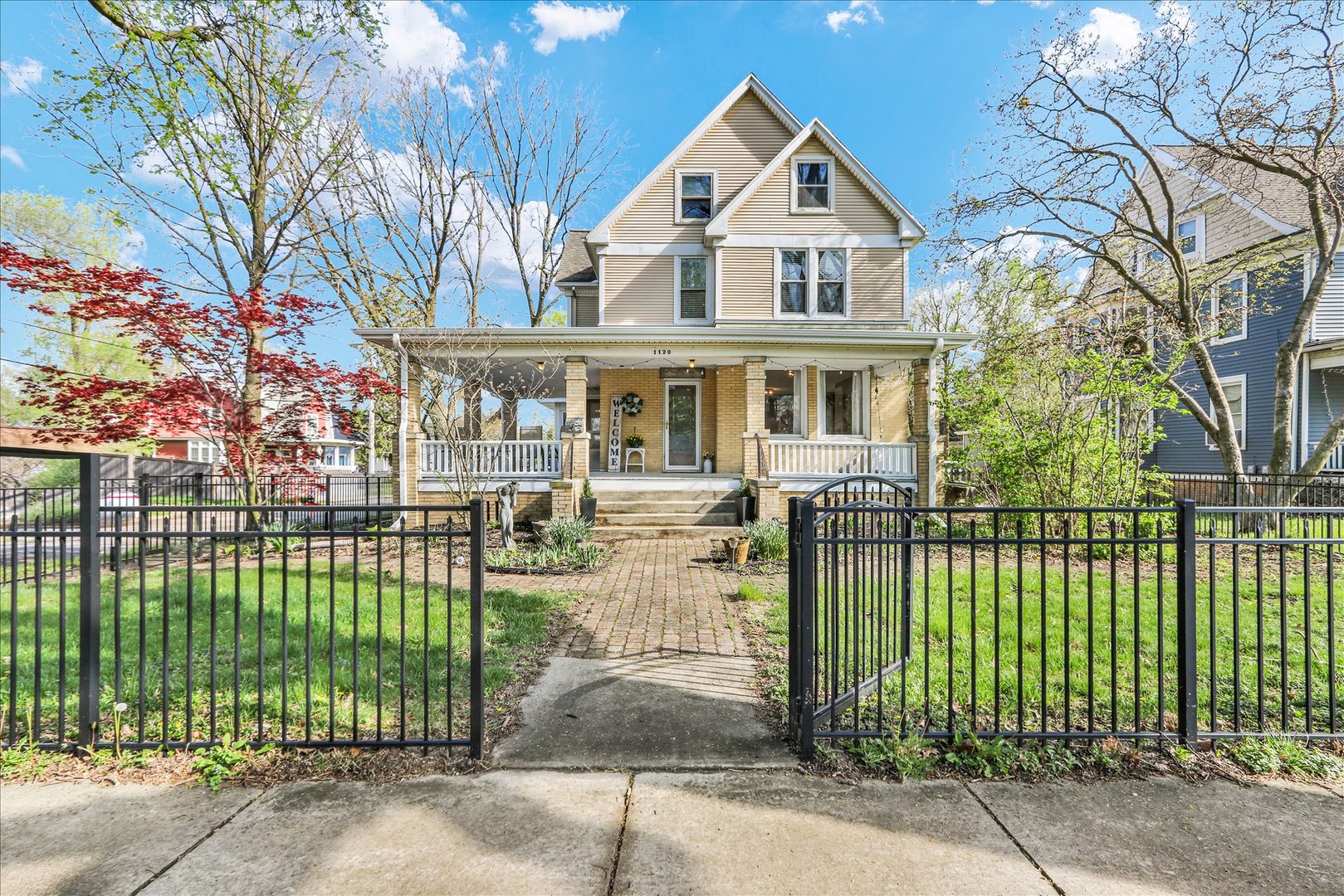 front view of a house with a garden