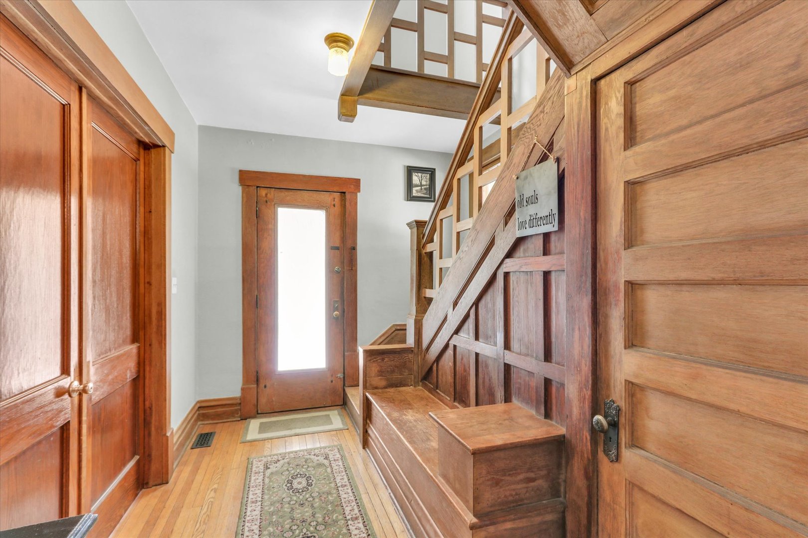 1120 West Church Street Champaign, IL 61821 - Photo 12 of 48 a view of entryway with wooden floor and a front door