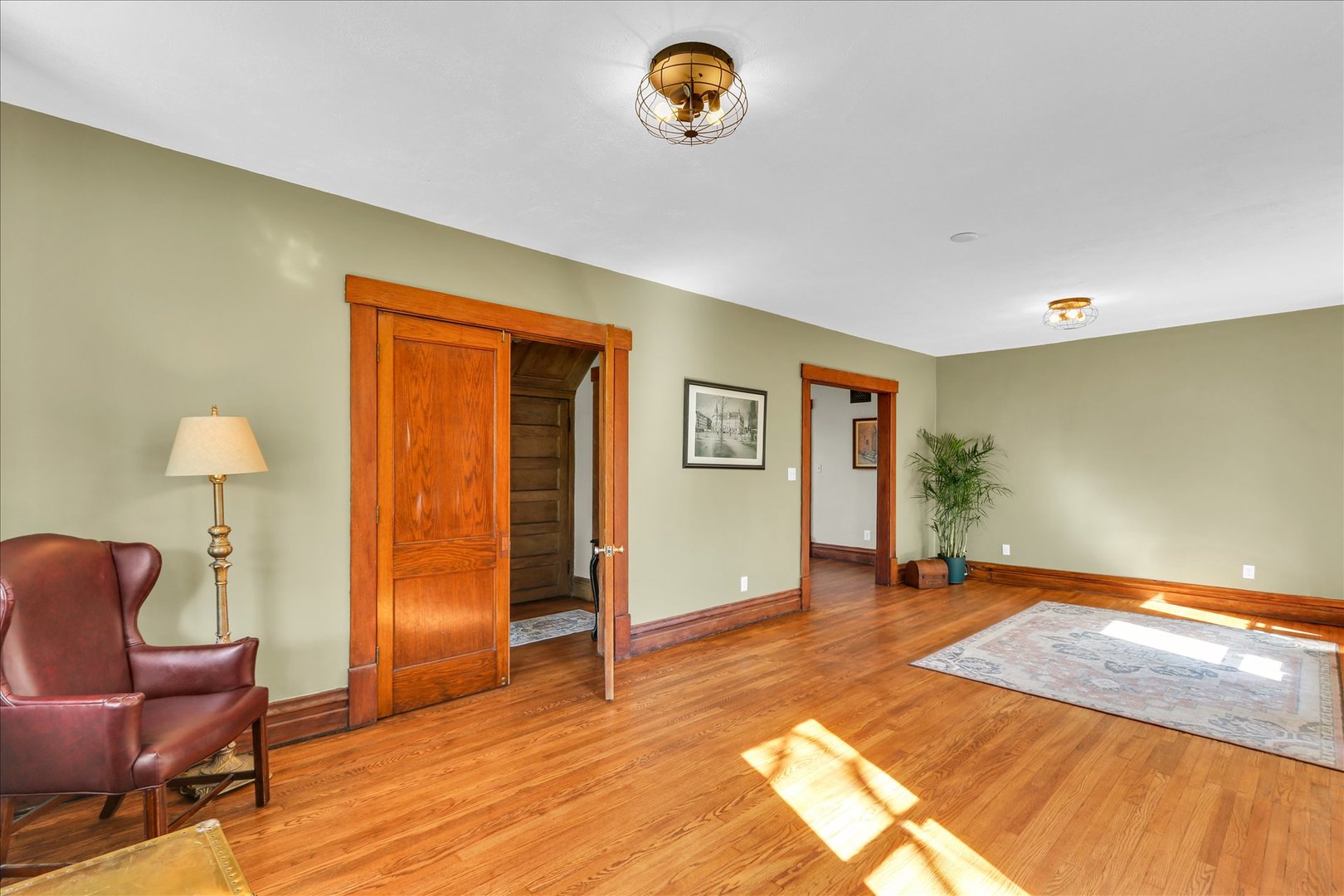 1120 West Church Street Champaign, IL 61821 - Photo 12 of 49 a view of livingroom with hardwood floor and cabinet