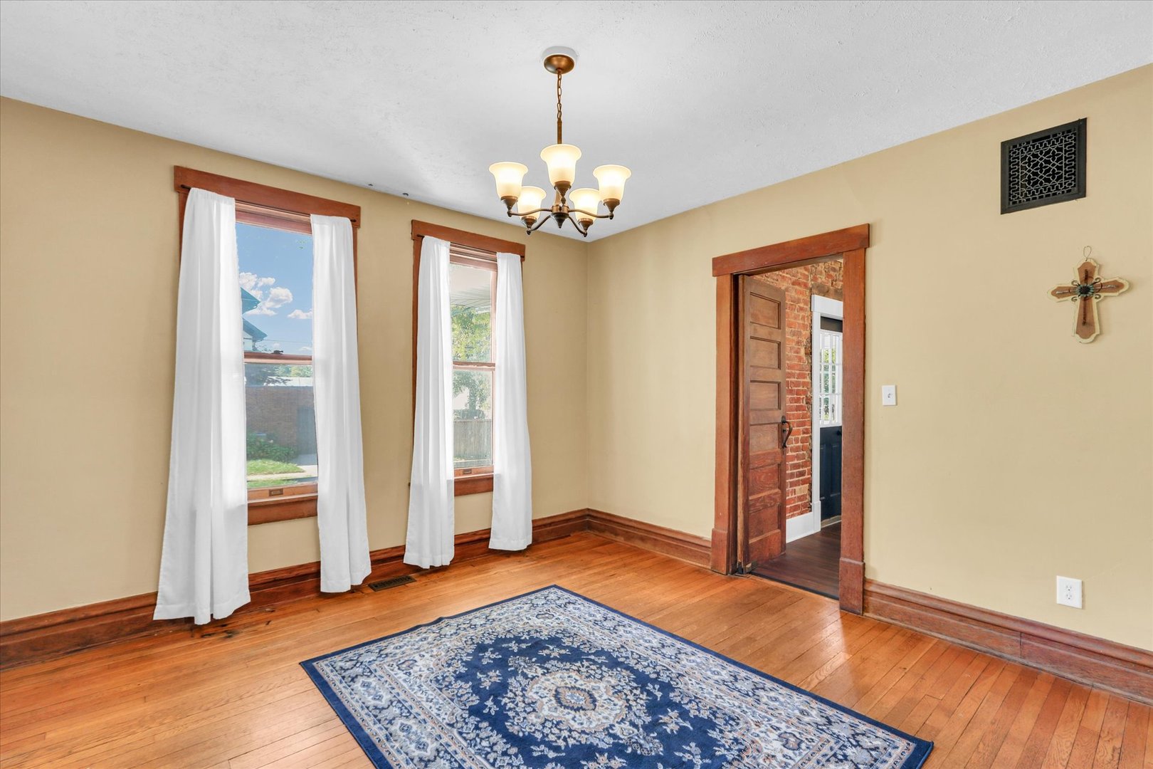 1120 West Church Street Champaign, IL 61821 - Photo 13 of 48 wooden floor in an empty room with a window