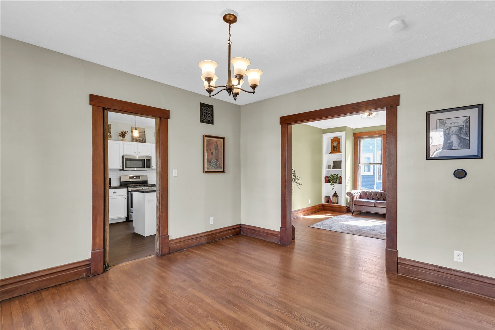 1120 West Church Street Champaign, IL 61821 - Photo 14 of 49 a view of a livingroom with wooden floor and a ceiling fan