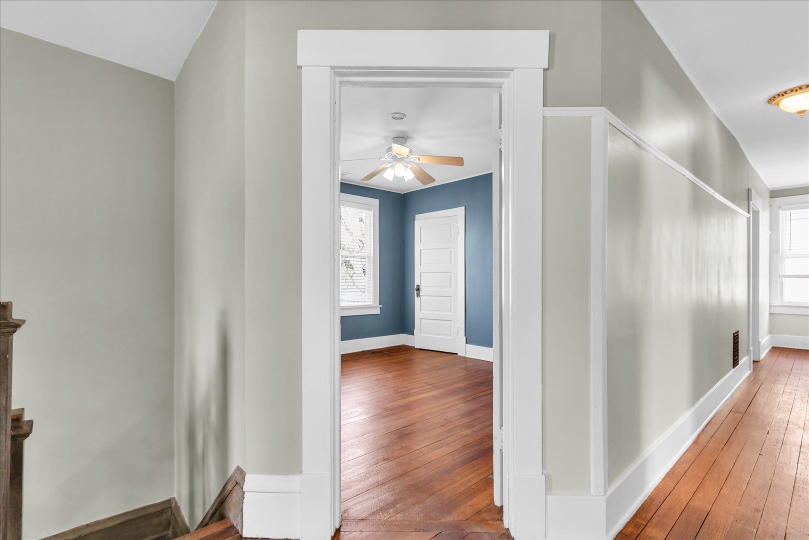 1120 West Church Street Champaign, IL 61821 - Photo 24 of 49 a view of a hallway with wooden floor and a bathroom