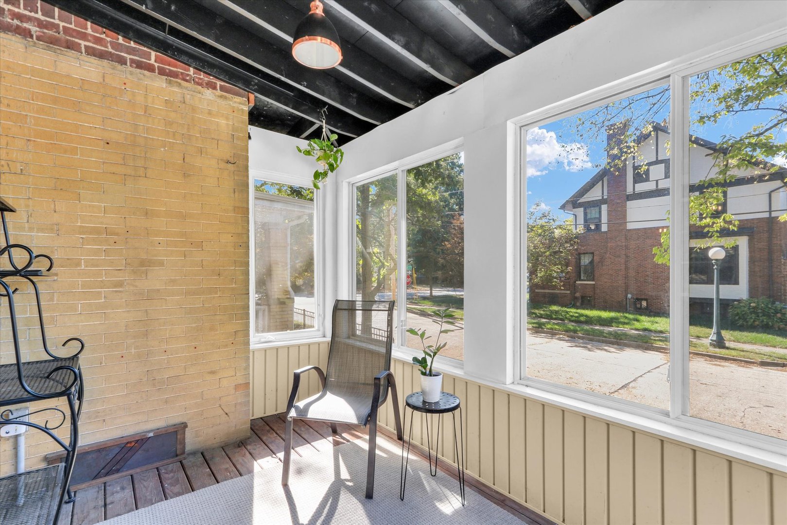 1120 West Church Street Champaign, IL 61821 - Photo 25 of 48 a view of a porch with chairs and couches in the balcony