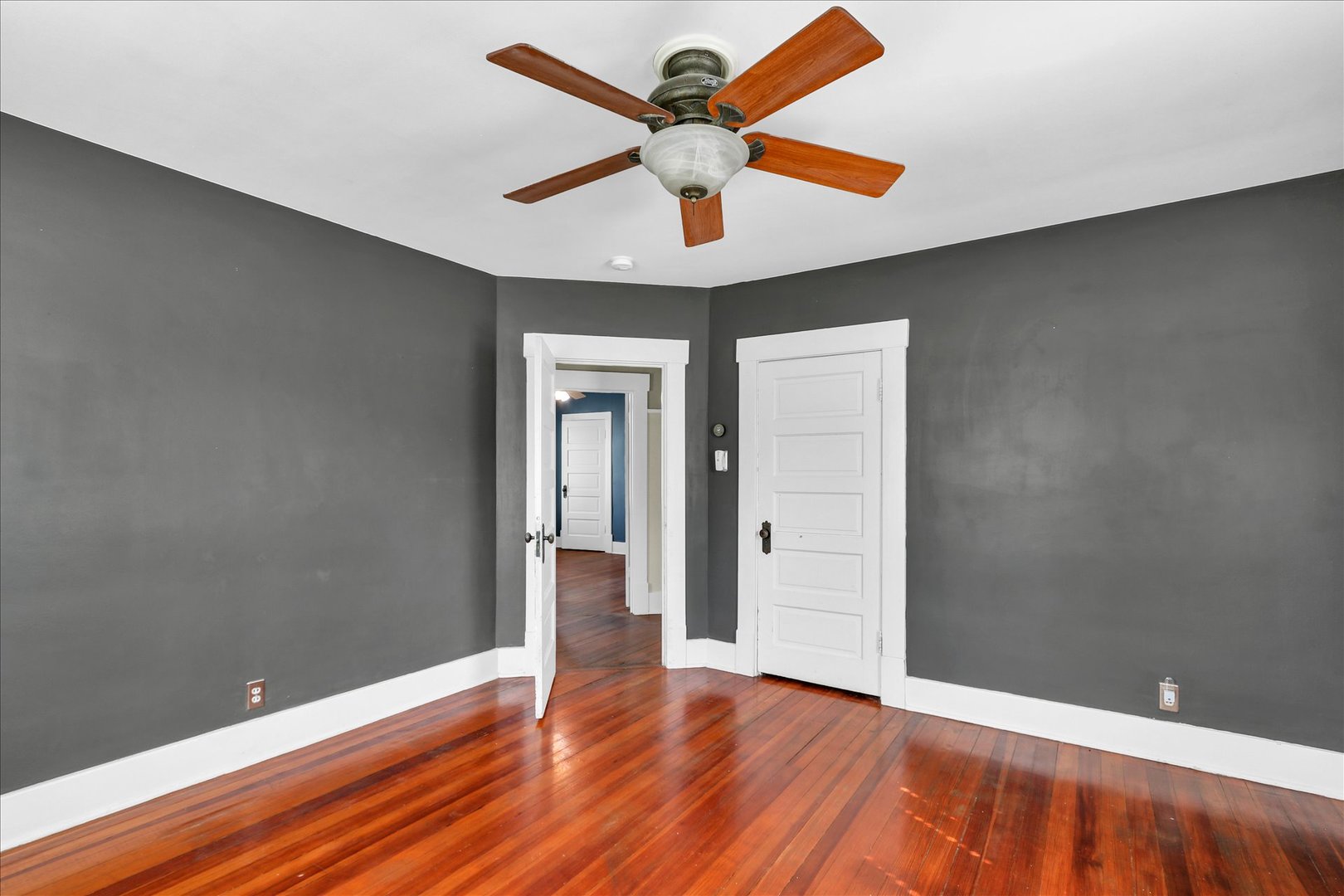 1120 West Church Street Champaign, IL 61821 - Photo 26 of 49 wooden floor in an empty room with a window