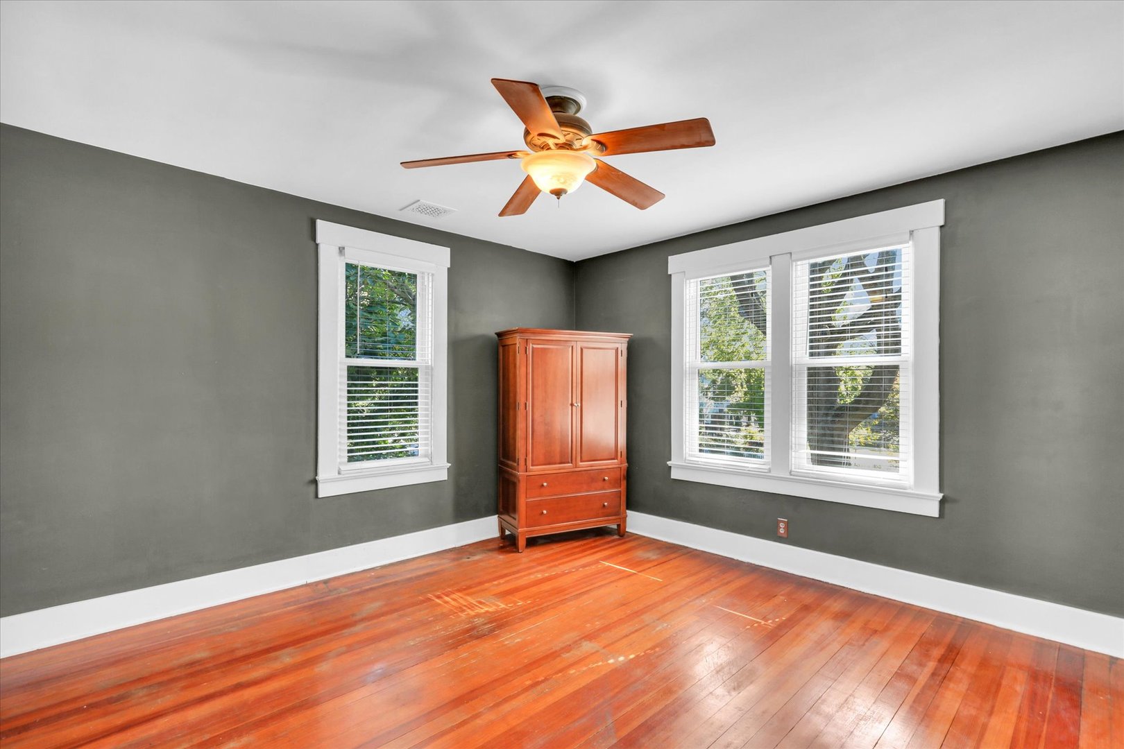 1120 West Church Street Champaign, IL 61821 - Photo 29 of 48 an empty room with a window and ceiling fan