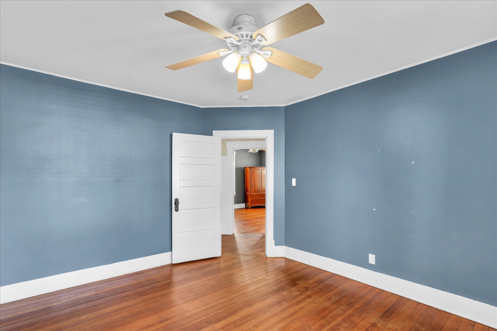 1120 West Church Street Champaign, IL 61821 - Photo 30 of 49 a view of an empty room with wooden floor