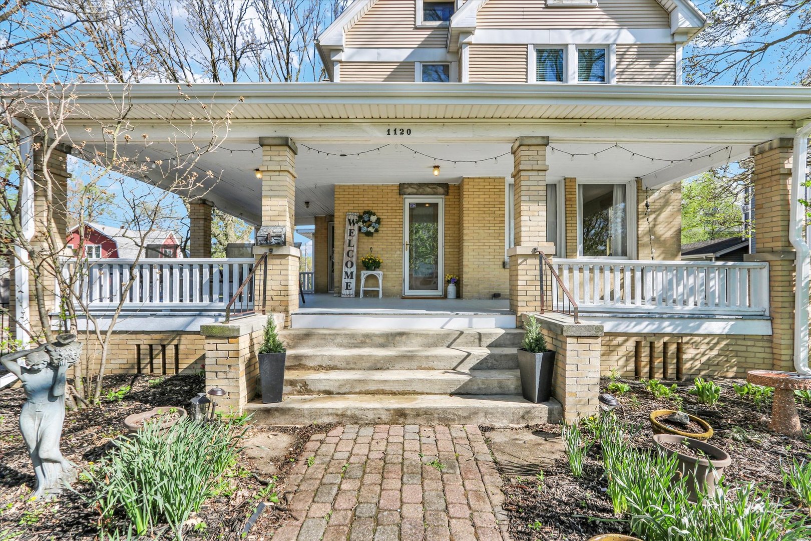 1120 West Church Street Champaign, IL 61821 - Photo 4 of 49 front view of a house with a porch
