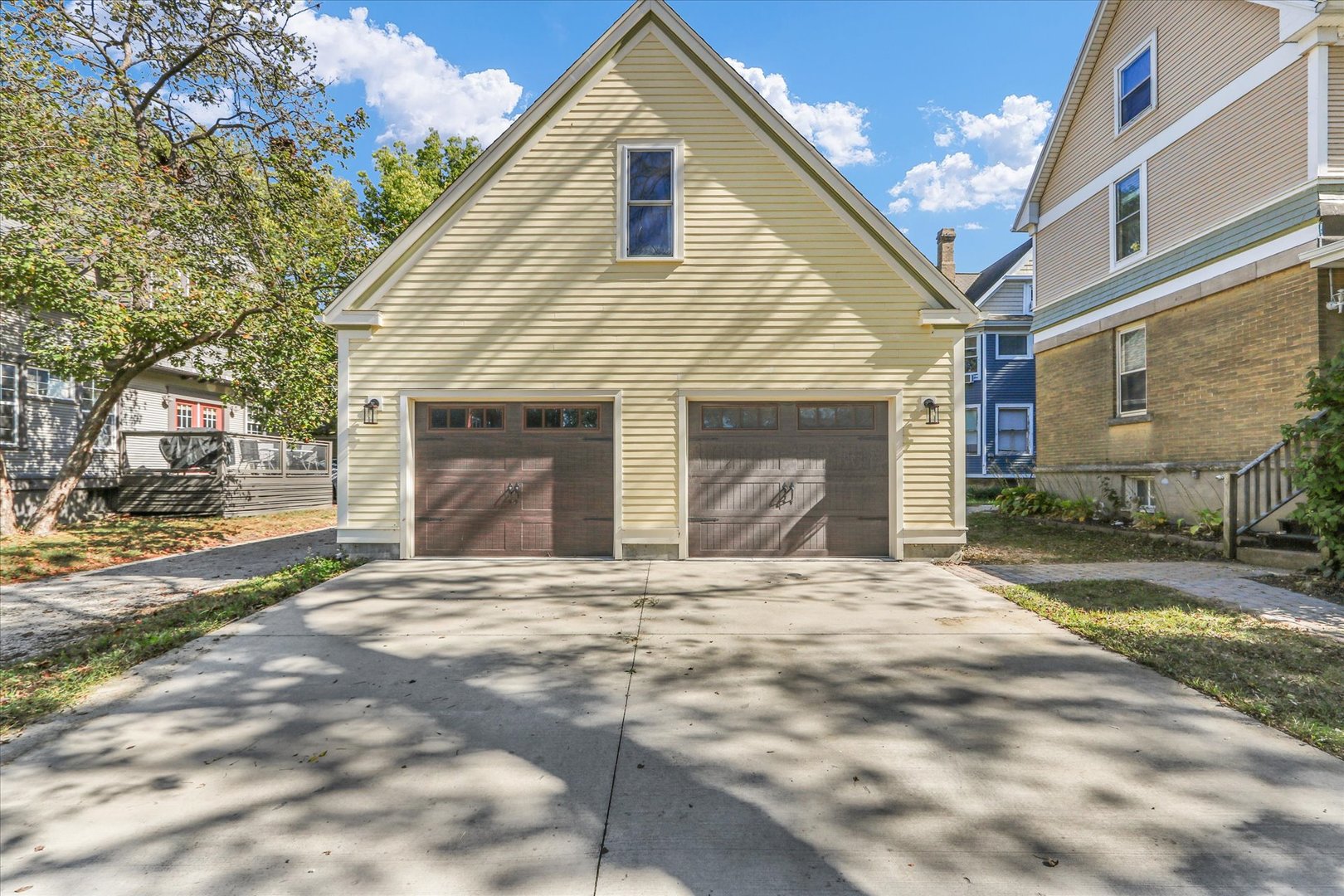 1120 West Church Street Champaign, IL 61821 - Photo 41 of 48 a front view of a house with a yard and garage