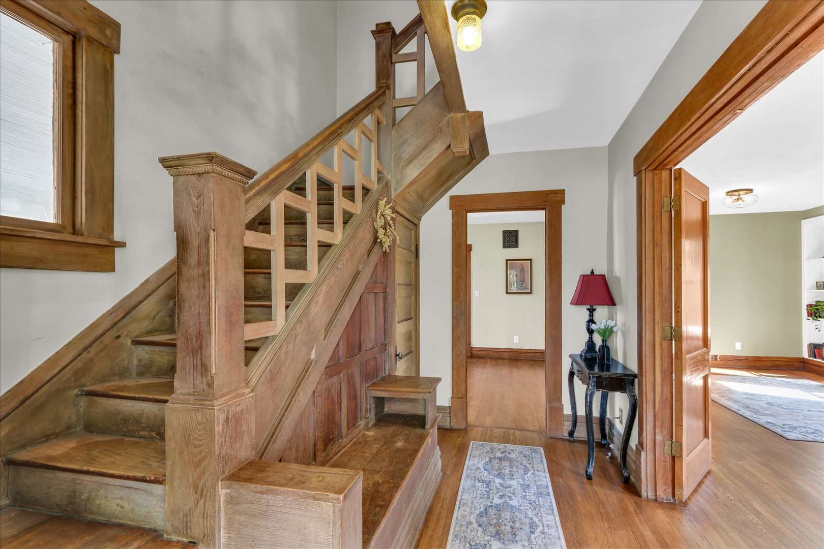 1120 West Church Street Champaign, IL 61821 - Photo 8 of 49 a view of an entryway with wooden floor and windows