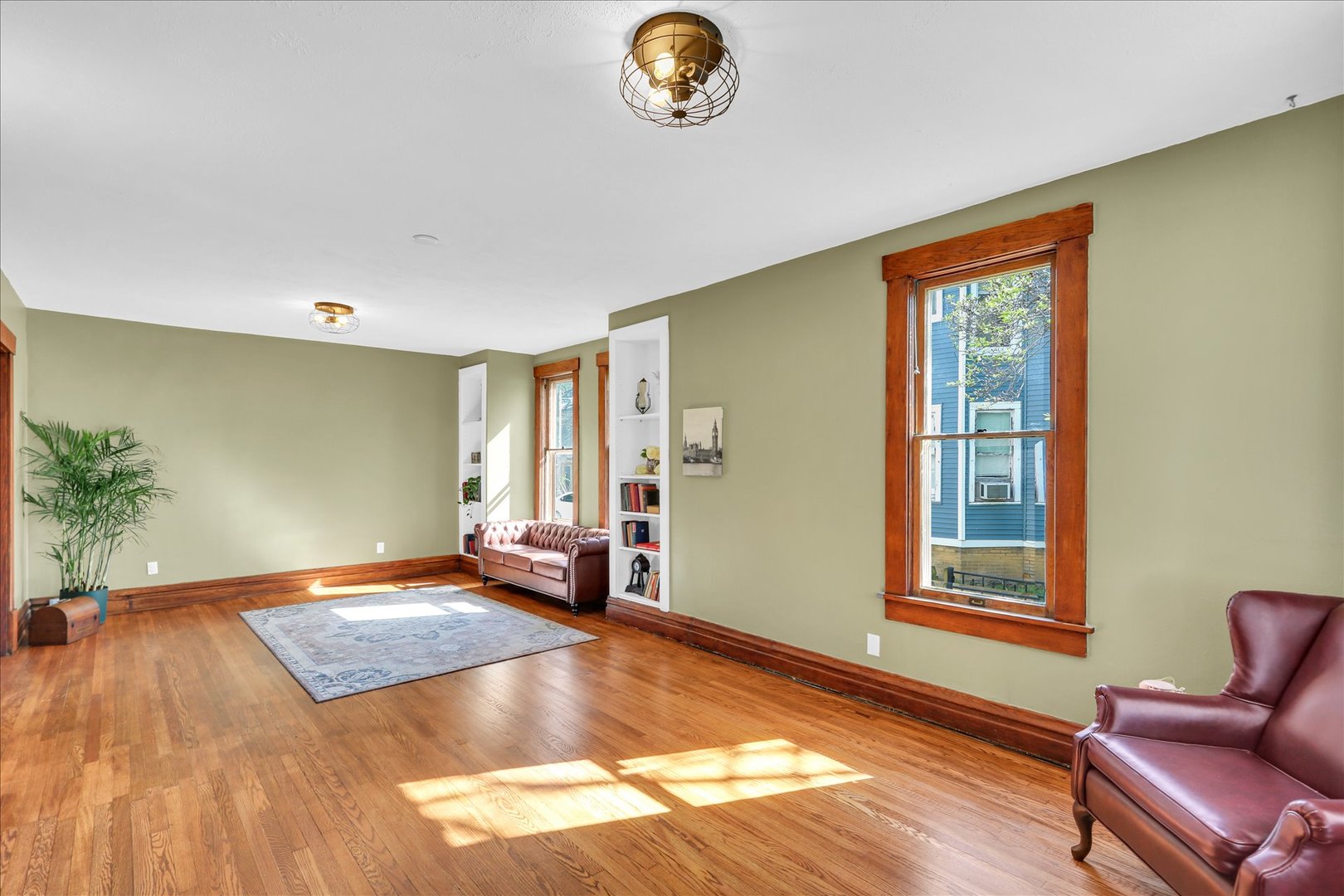 1120 West Church Street Champaign, IL 61821 - Photo 10 of 49 a view of livingroom with hardwood floor and window
