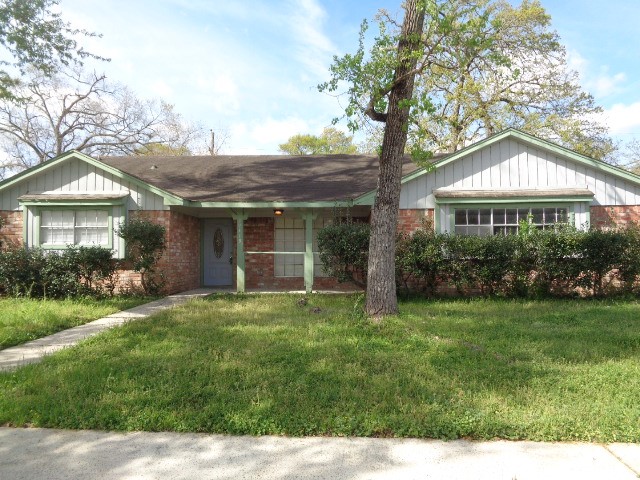 a front view of a house with a yard and porch