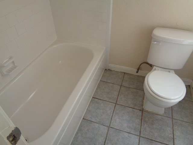29419 Raestone Street Spring, TX 77386 - Photo 14 of 19 a white toilet sitting next to a bath tub