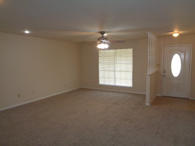 29419 Raestone Street Spring, TX 77386 - Photo 15 of 19 an empty room with windows and fan
