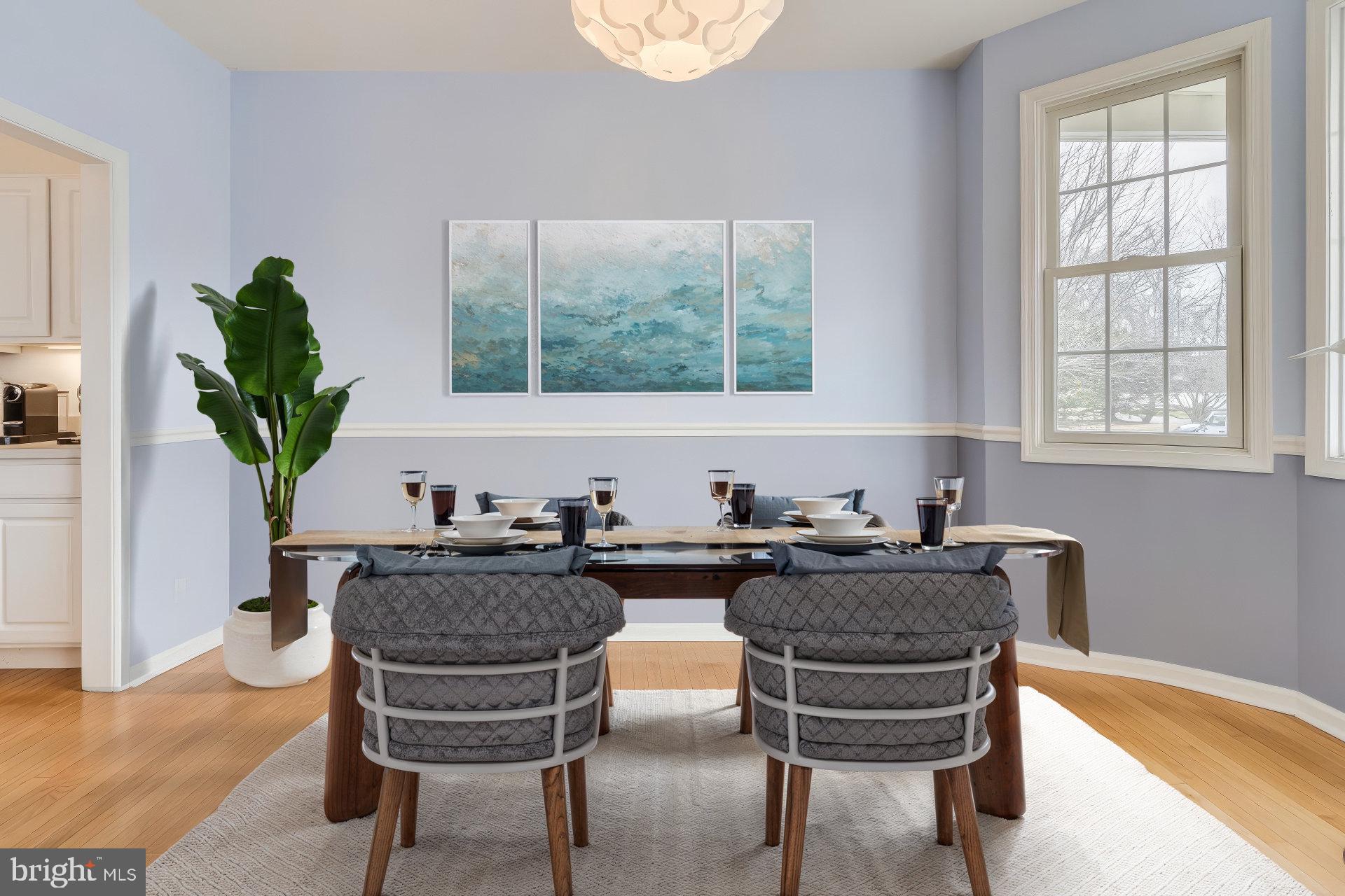 14 Doolin Lane Rehoboth Beach, DE 19971 - Photo 15 of 37 a kitchen with a table chairs and a potted plant