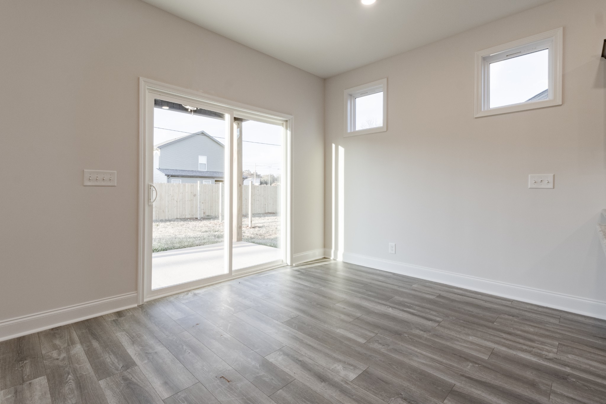 217 Clark Road Clarksville, TN 37042 - Photo 17 of 36 a view of an empty room with wooden floor and a window